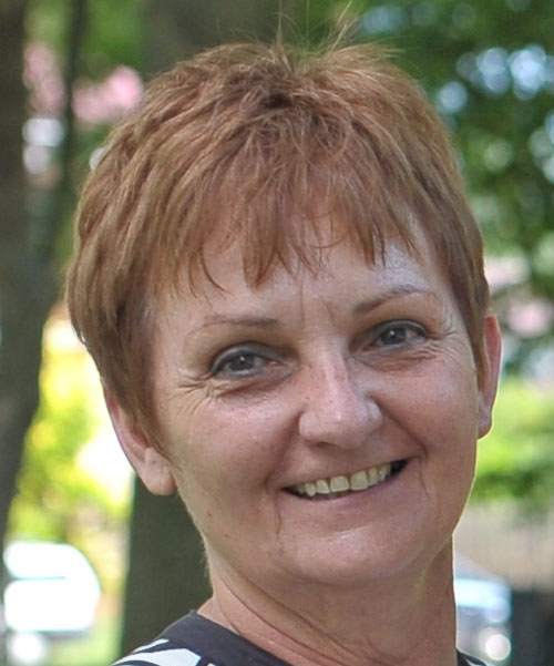 Photo of white woman with short reddish blonde hair