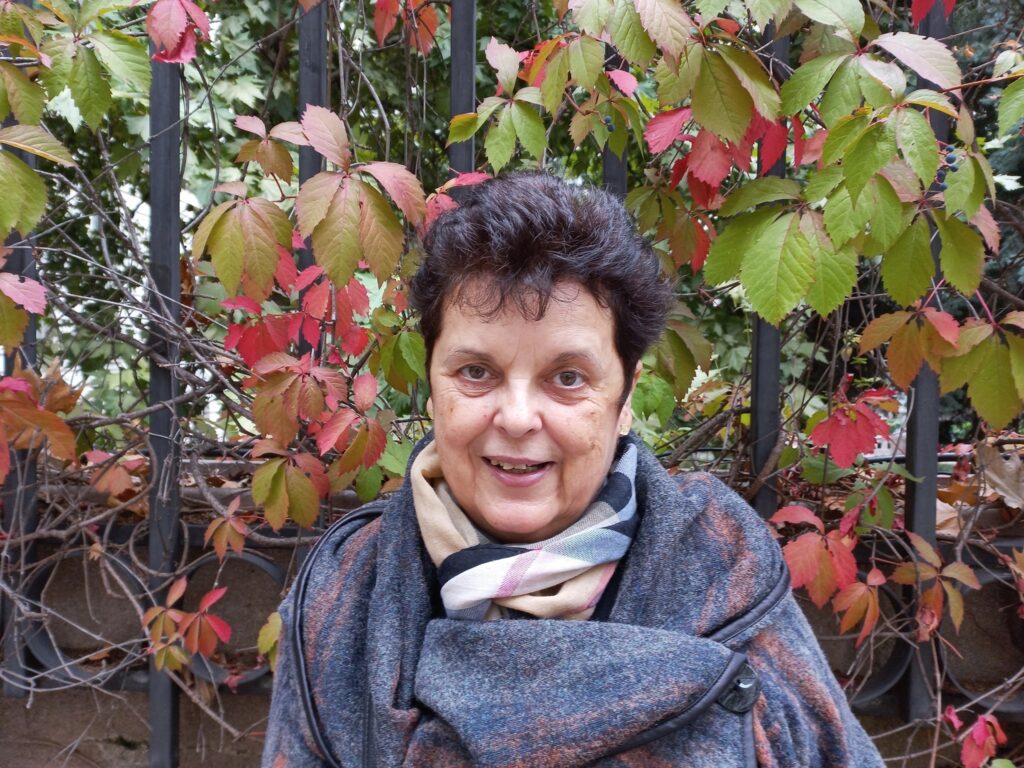 Woman in front of fall leaves