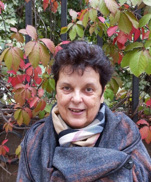 Woman in front of fall leaves