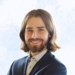 Adam Cerny a white man with a mustache and beard wearing a shirt and sport coat