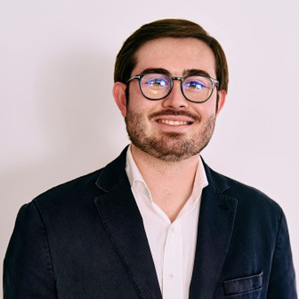 Jose Mareno Marin is wearing glasses and a sportcoat