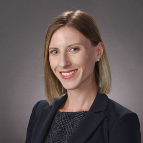 Kotryna Smith is a blond woman wearing a black dress