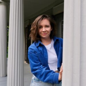 photo of woman in blue shirt with columnsnear her (Katarzyna (Kasia) Zarzycka )