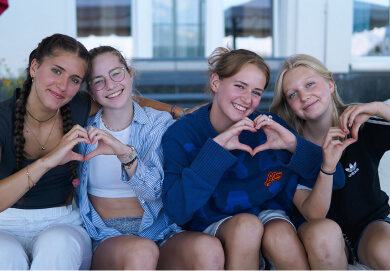 mission-mobile (1) girls making heart sign with their hands