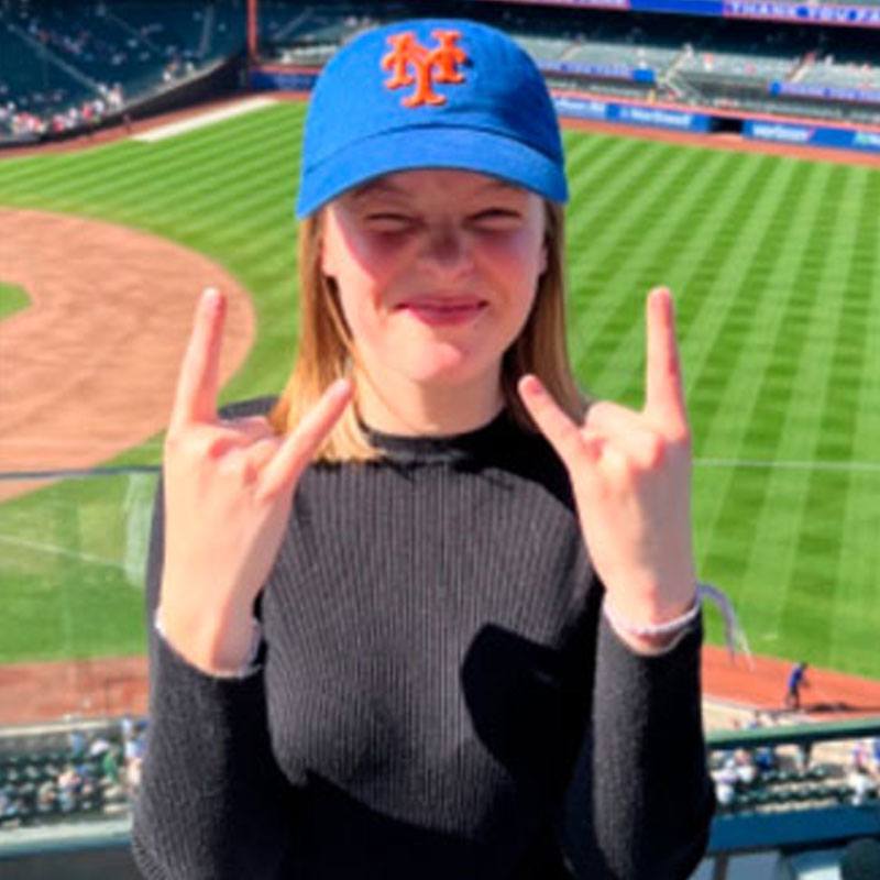 female student wearing baseball cap