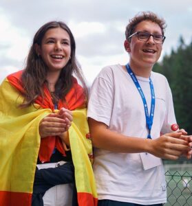 international students smiling with spanish flag